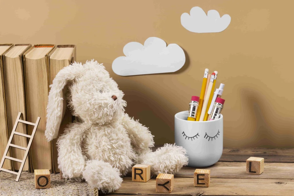 plush toys laying on bools arangement with permanent marker