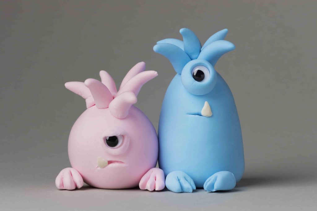 two fantasy creature with pink and blue color plush toys