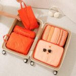 travel organizer bag set with orange color for what are packing cubes