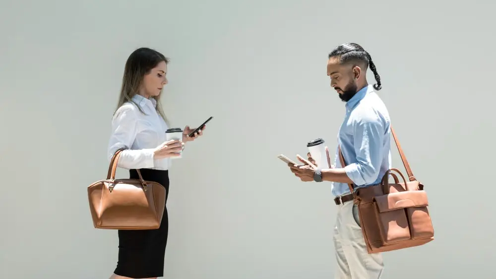 a man and female showing the difference of bag size